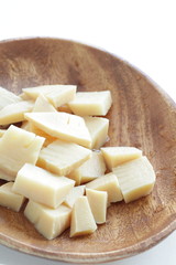 Boiled bamboo shoots on wooden plate with copy space