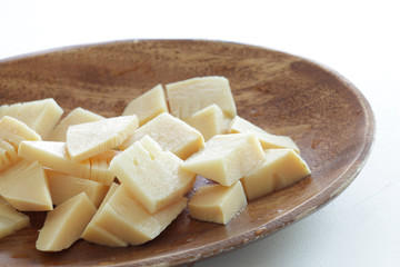 Boiled bamboo shoots on wooden plate with copy space