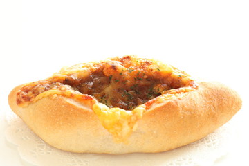 Cheese and mince meat French bread on white dish for breakfast