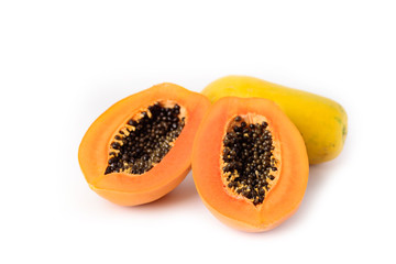 Half ripe papaya fruit isolated on white background