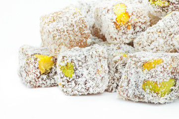 Turkish delight isolated on white background, traditional turkish sweet double roasted with pistachio nuts and coconut