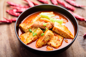 Kimchi soup with tofu in bowl, Korean food (Kimchi Jjigae)