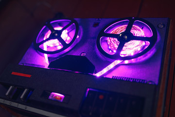 reel to reel audio tape recorder with purple led light strip