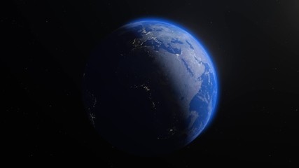 The Earth slowly rotating in space, backlit by the sun with the lights of the planet's cities visible on the surface. The sun drifts across frame as the world turns, revealing the continents at night.