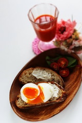 soft boiled egg on cream cheese toast for gourmet comfort breakfast