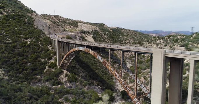 Beautiful rusty bridge with cars speeding along, Arizona