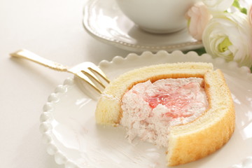 Strawberry jam Swiss roll and tea