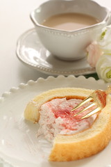 Strawberry jam Swiss roll and tea