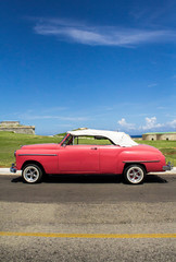 Fototapeta na wymiar old red car on the road, La Havana Cuba