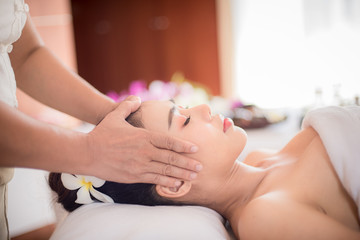 Fototapeta na wymiar Body care. Spa body massage Asian woman hands treatment. Woman having massage in the spa salon