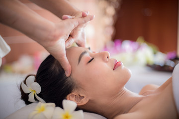 Obraz na płótnie Canvas Body care. Spa body massage Asian woman hands treatment. Woman having massage in the spa salon