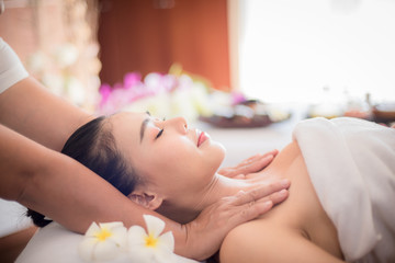 Fototapeta na wymiar Body care. Spa body massage Asian woman hands treatment. Woman having massage in the spa salon