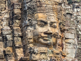 One of many stone faces of Angkor Thom - Siem Reap, Cambodia