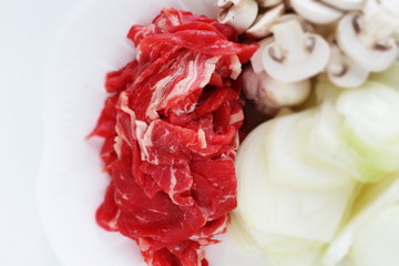 Raw food ingredient, beef and onion with sliced mushroom,