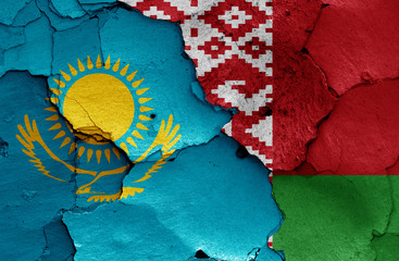 flags of Kazakhstan and Belarus painted on cracked wall