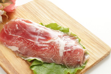 sliced ham on plate with copy space for gourmet