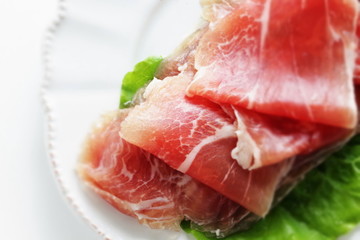 sliced ham on plate with copy space for gourmet