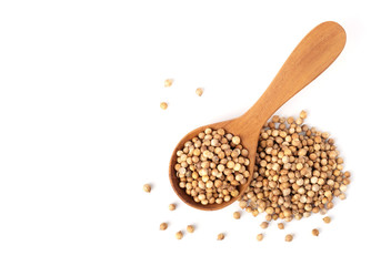 Pile of Coriander seeds and in wooden spoon isolated on white background with copy space, flat lay