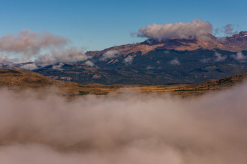 Scene view of Andes mountain landscape with low clouds in Esquel, Patagonia, Argentina