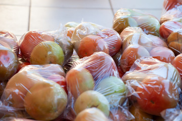 ripe Tomatoes packaged.stacked together