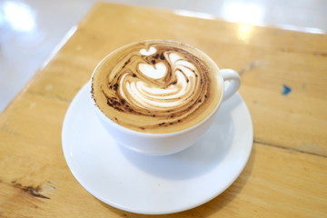 hot latte coffee put on table in cafe , drink breakfast in the morning day
