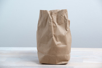 crumpled paper bag on white background.