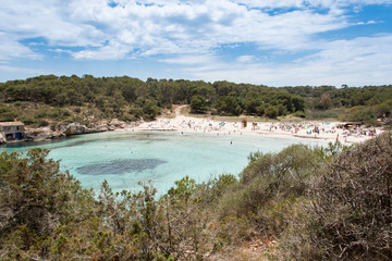 Beach with people and sea landscape in Santanyi, Majorca