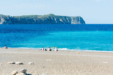 Fototapeta na wymiar Beach with people and sea landscape in Coll Baix, Majorca