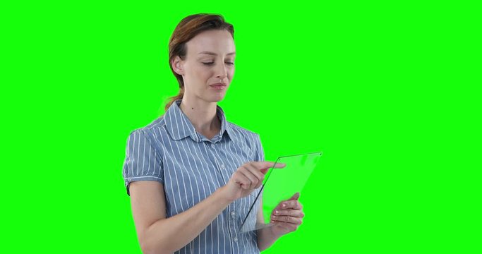 woman holding a transparent screen on green background