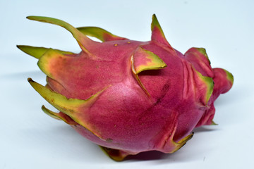 Ripe pink dragon fruit isolated on a white background.