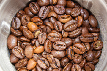 Closeup picture of coffee bean grinder and coffee bean