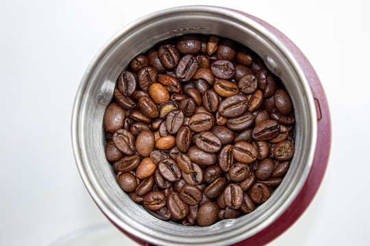 Closeup picture of coffee bean grinder and coffee bean