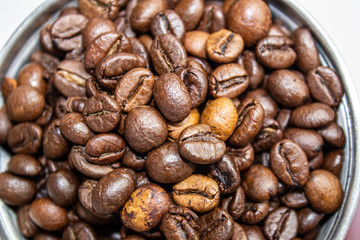 Closeup picture of coffee bean grinder and coffee bean