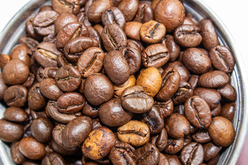 Closeup picture of coffee bean grinder and coffee bean