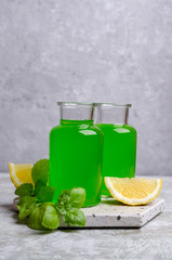Green liquid in a glass bottle