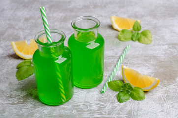Green liquid in a glass bottle