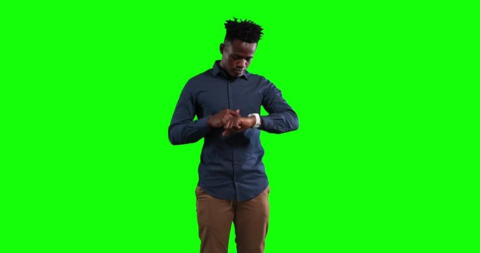 Animation of African American man checking his smartwatch in a green background