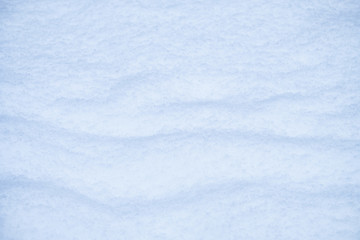 Snow texture. Natural winter background with snow waves