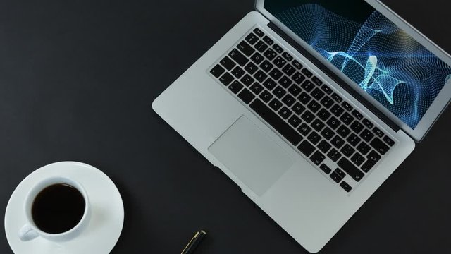 Animation of a laptop with a blue cloud animation on the screen