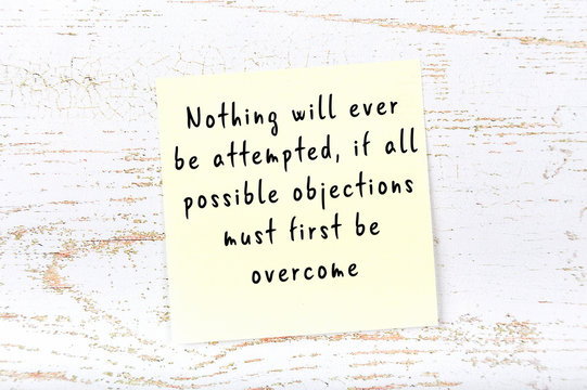 Yellow sticky note with handwritten motivational quote
