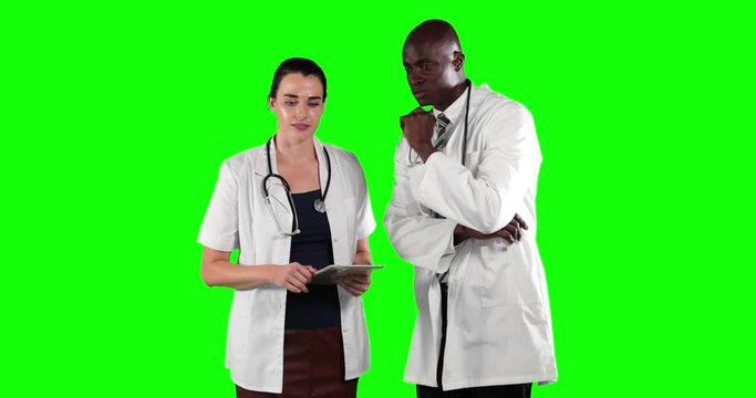 Animation of African Americanman and Caucasian woman wearing a surgeon blouse and scrubs in a green