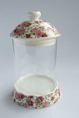 An empty glass food container isolated from a white background