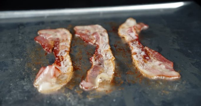 Bacon slices fried with spices.