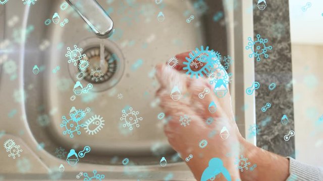 Animation of macro Covid-19 cells icons floating over a person washing hands