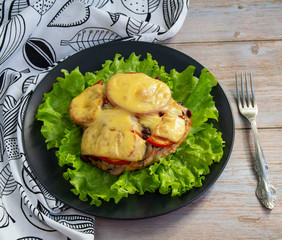 Baked chicken with mushrooms and vegetables and cheese with herbs