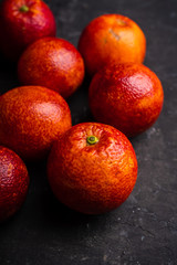 Ripe bloody oranges on the rustic background. Selective focus. Shallow depth of field.