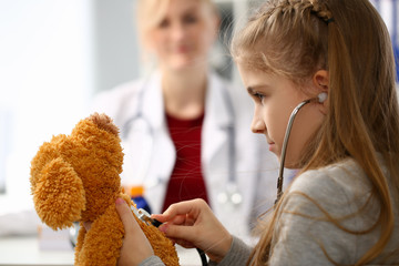 Female hand of little girl hold stethoscope listen