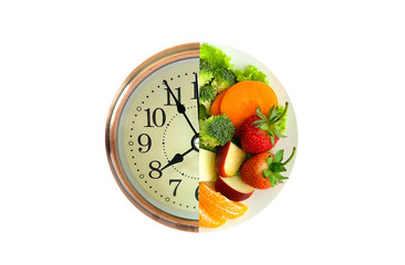 Antique clock needles Fruit healthy. Healthy food concept.