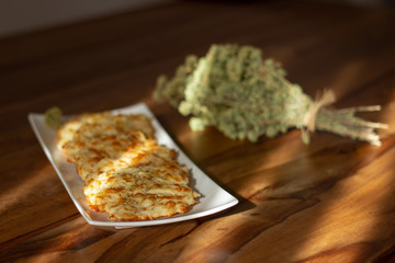 mashed cheeses in a white plate with a bunch of oregano