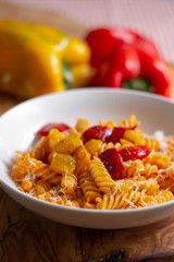 pasta with pepper cream and pieces of red and yellow pepper